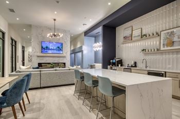 Resident e-lounge with coffee bar, game room & coworking stations